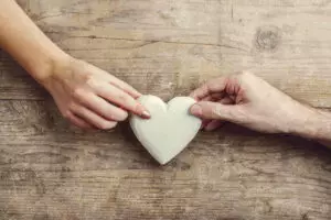 rsz hands of man and woman connected through a heart pkzck
